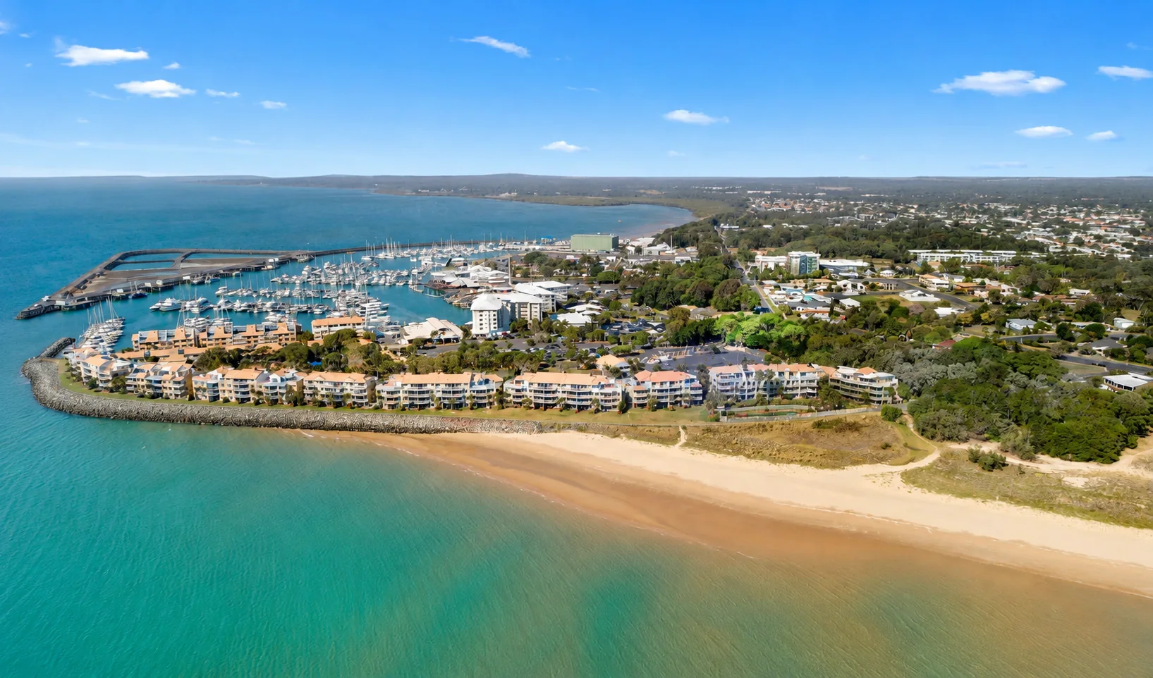 Aerial view of Urangan Boat Harbour, the beach and Hervey Bay